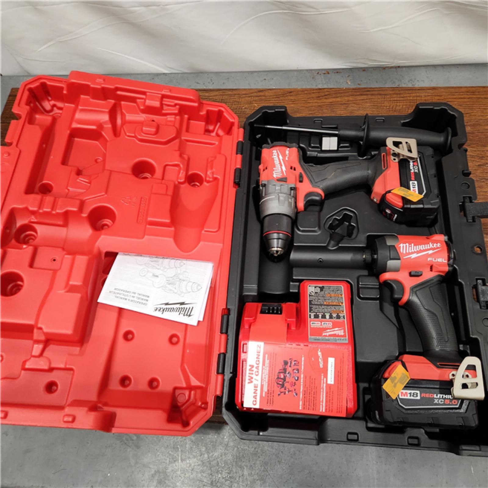 AS-IS Milwaukee M18 FUEL 18V Lithium-Ion Brushless Cordless Hammer Drill and Impact Driver Combo Kit (2-Tool) with 2 Batteries