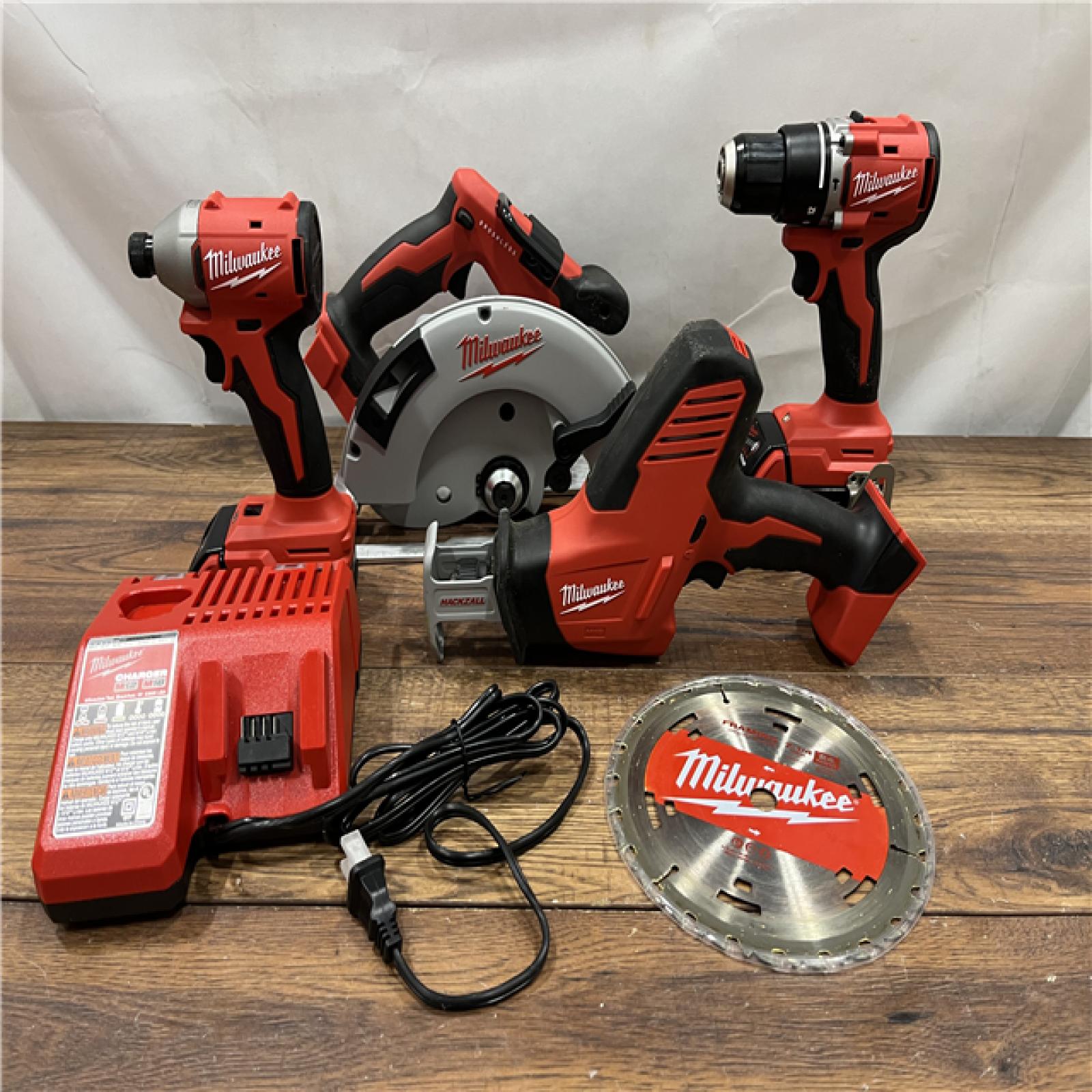 AS IS Milwaukee M18 18-Volt Lithium-Ion Brushless Cordless Combo Kit (4-Tool) with 2-Batteries, 1-Charger and Tool Bag