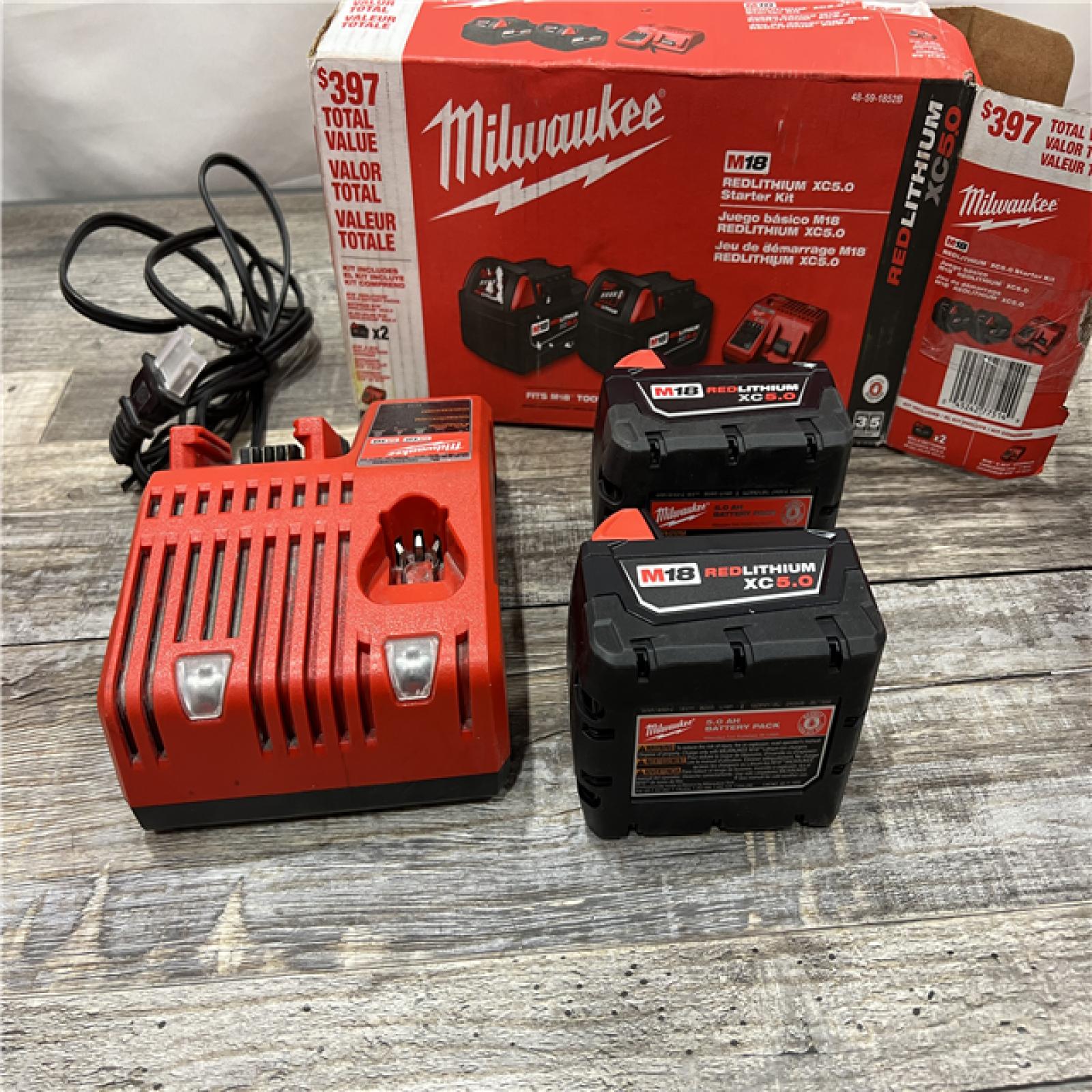 AS-IS Milwaukee M18 18-Volt Lithium-Ion XC Starter Kit with Two 5.0Ah Batteries / Charger (48-59-1852B)