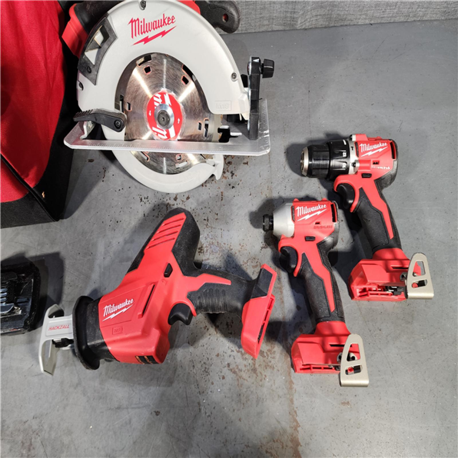 HOUSTON LOCATION - AS-IS Milwaukee M18 18-Volt Lithium-Ion Brushless Cordless Combo Kit (4-Tool) with 2-Batteries, 1-Charger and Tool Bag