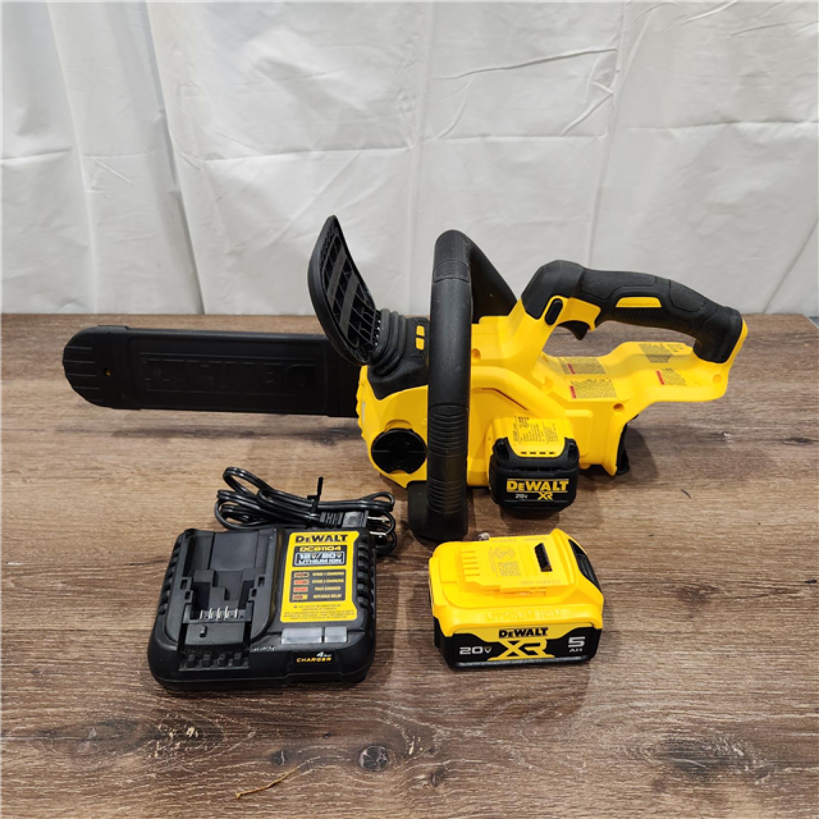 AS-IS Dewalt 7605686 12 in. 20V Battery Powered Chainsaw