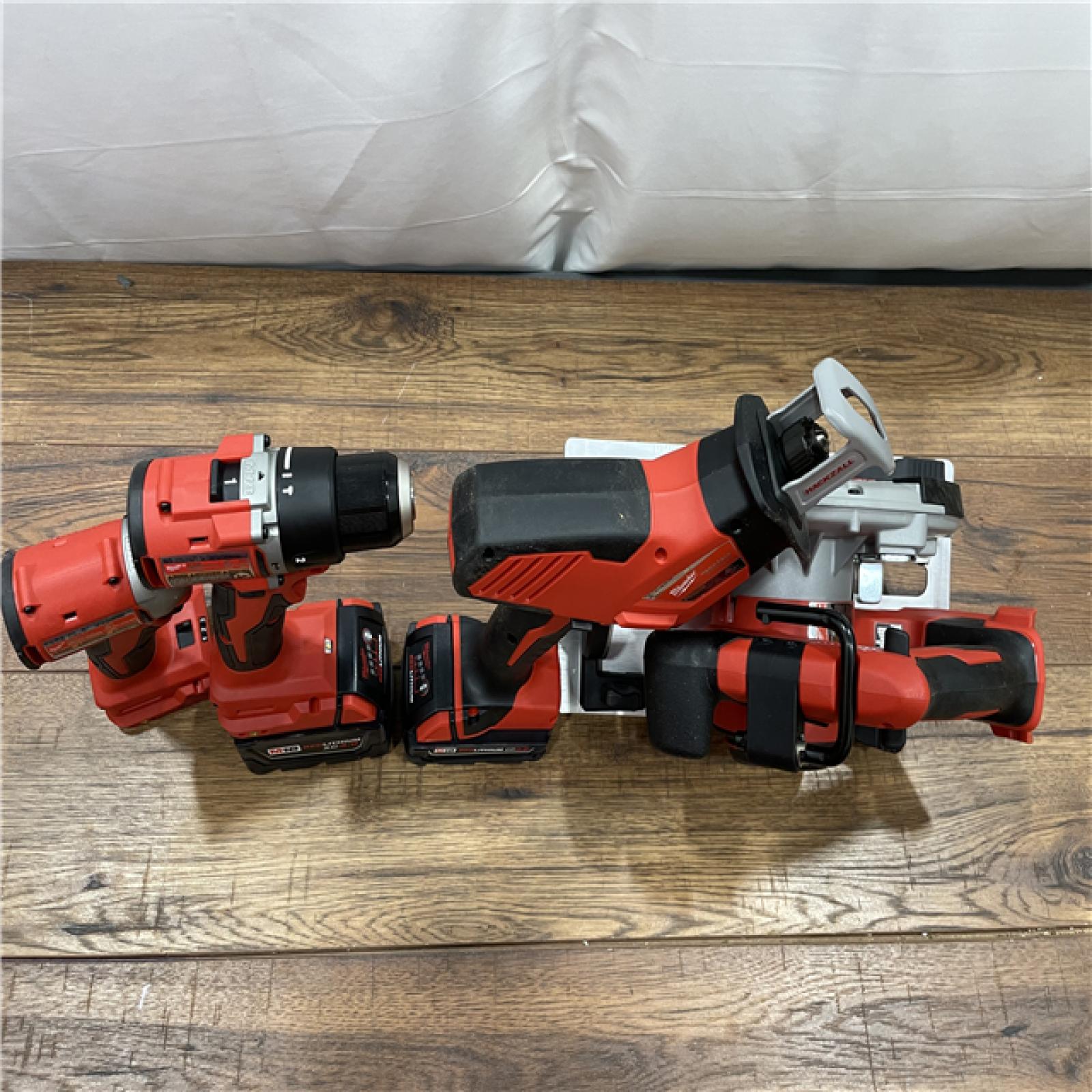 AS-IS Milwaukee M18 18-Volt Lithium-Ion Brushless Cordless Combo Kit (4-Tool) with 2-Batteries, 1-Charger and Tool Bag