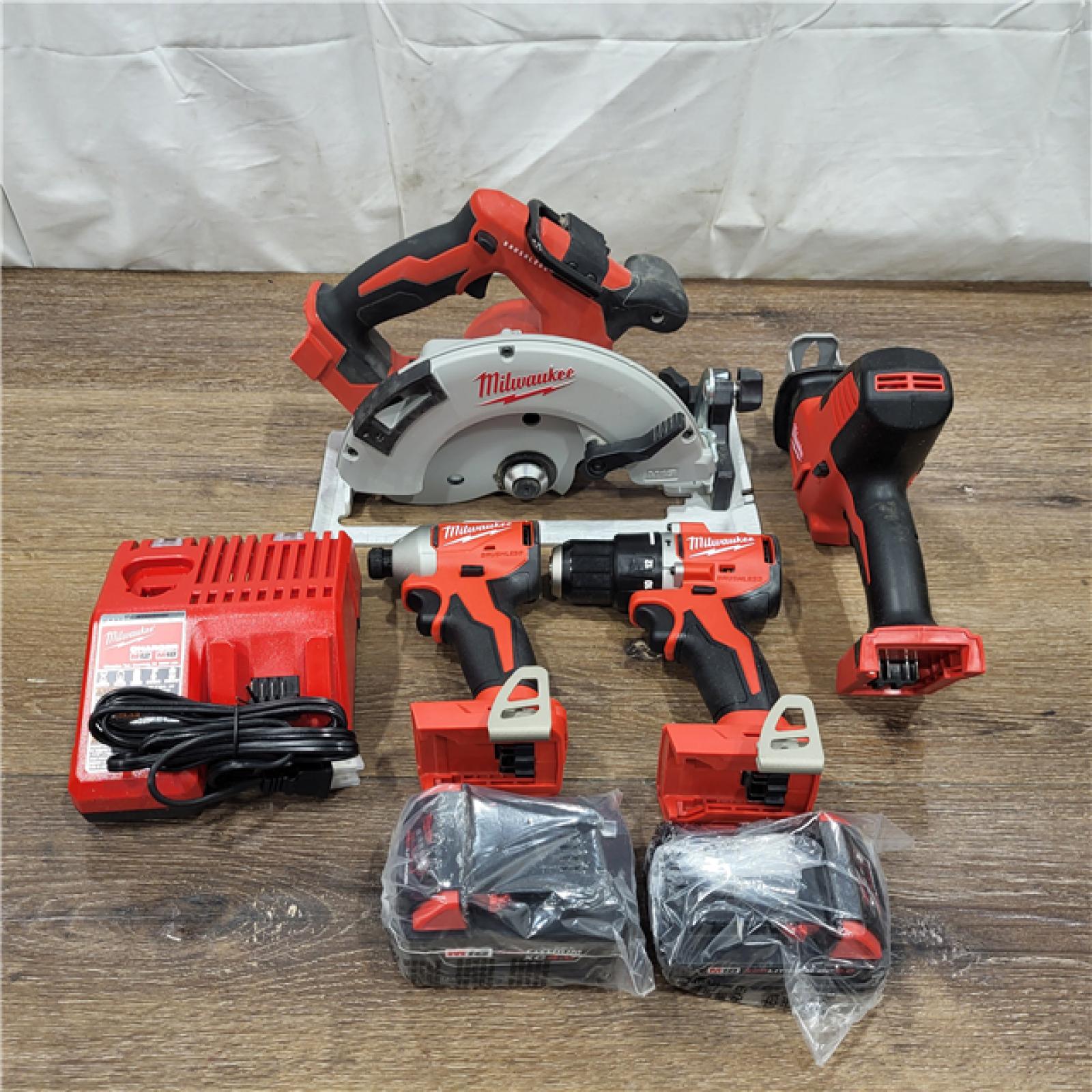 AS-IS Milwaukee M18 18-Volt Lithium-Ion Brushless Cordless Combo Kit (4-Tool) with 2-Batteries, 1-Charger and Tool Bag