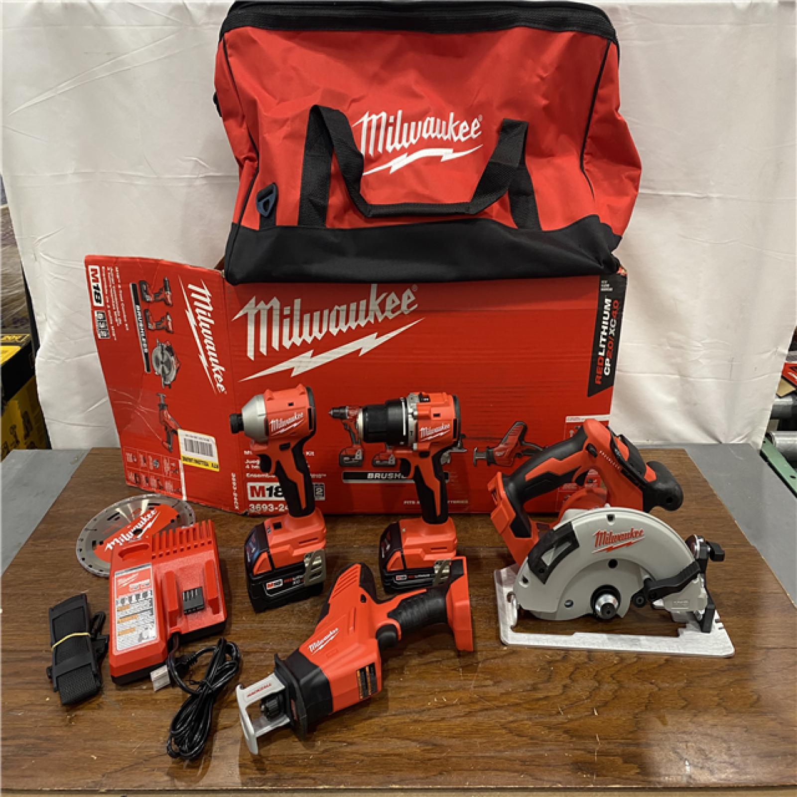 AS-IS Milwaukee M18 18-Volt Lithium-Ion Brushless Cordless Combo Kit (4-Tool) with 2-Batteries, 1-Charger and Tool Bag