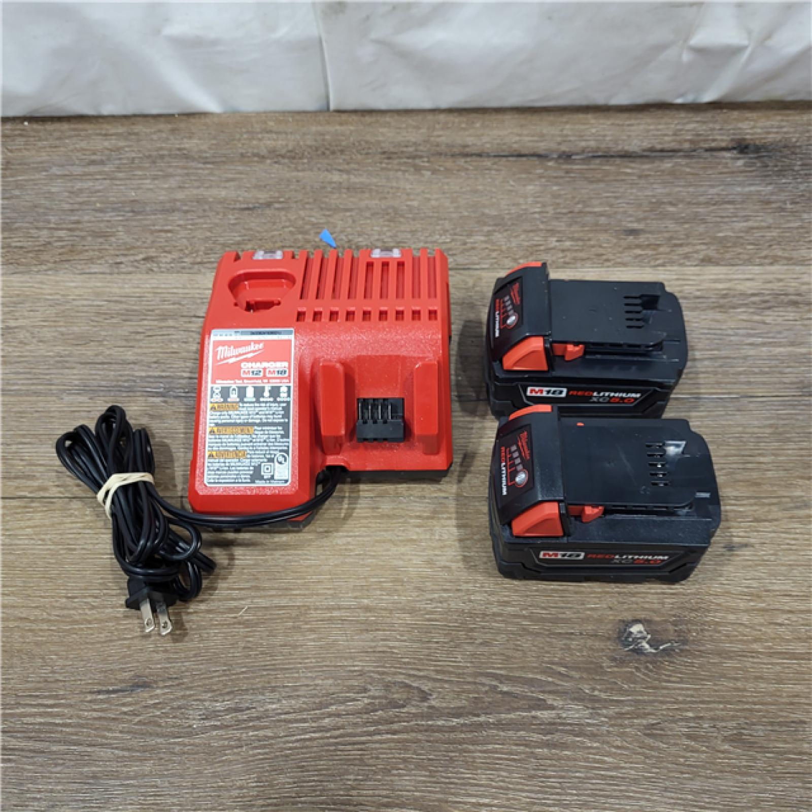 AS-IS Milwaukee M18 18-Volt Lithium-Ion XC Starter Kit with Two 5.0Ah Batteries / Charger (48-59-1852B)