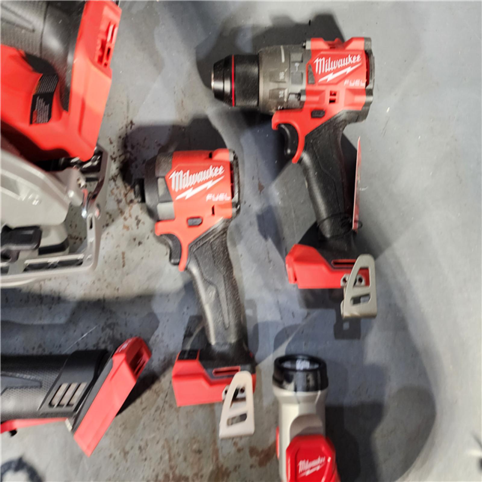 HOUSTON LOCATION - AS-IS (APPEARS LIKE NEW) M18 18-Volt Lithium-Ion Brushless Cordless FUEL Combo Kit (5-Tool) with 2-Batteries, 1-Charger, and Tool Bag