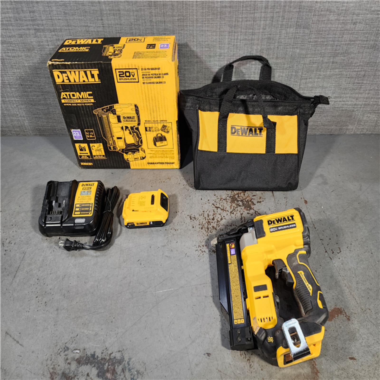 HOUSTON LOCATION - AS-IS DEWALT ATOMIC 20V MAX Lithium Ion Cordless 23 Gauge Pin Nailer Kit with 2.0Ah Battery and Charger