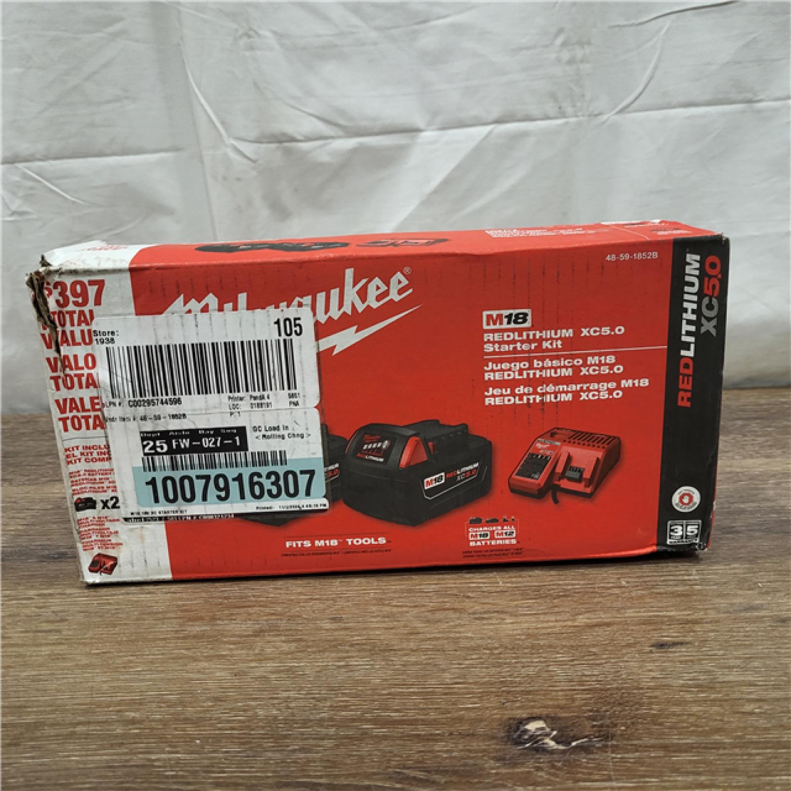 AS-IS Milwaukee M18 18-Volt Lithium-Ion XC Starter Kit with Two 5.0Ah Batteries / Charger (48-59-1852B)