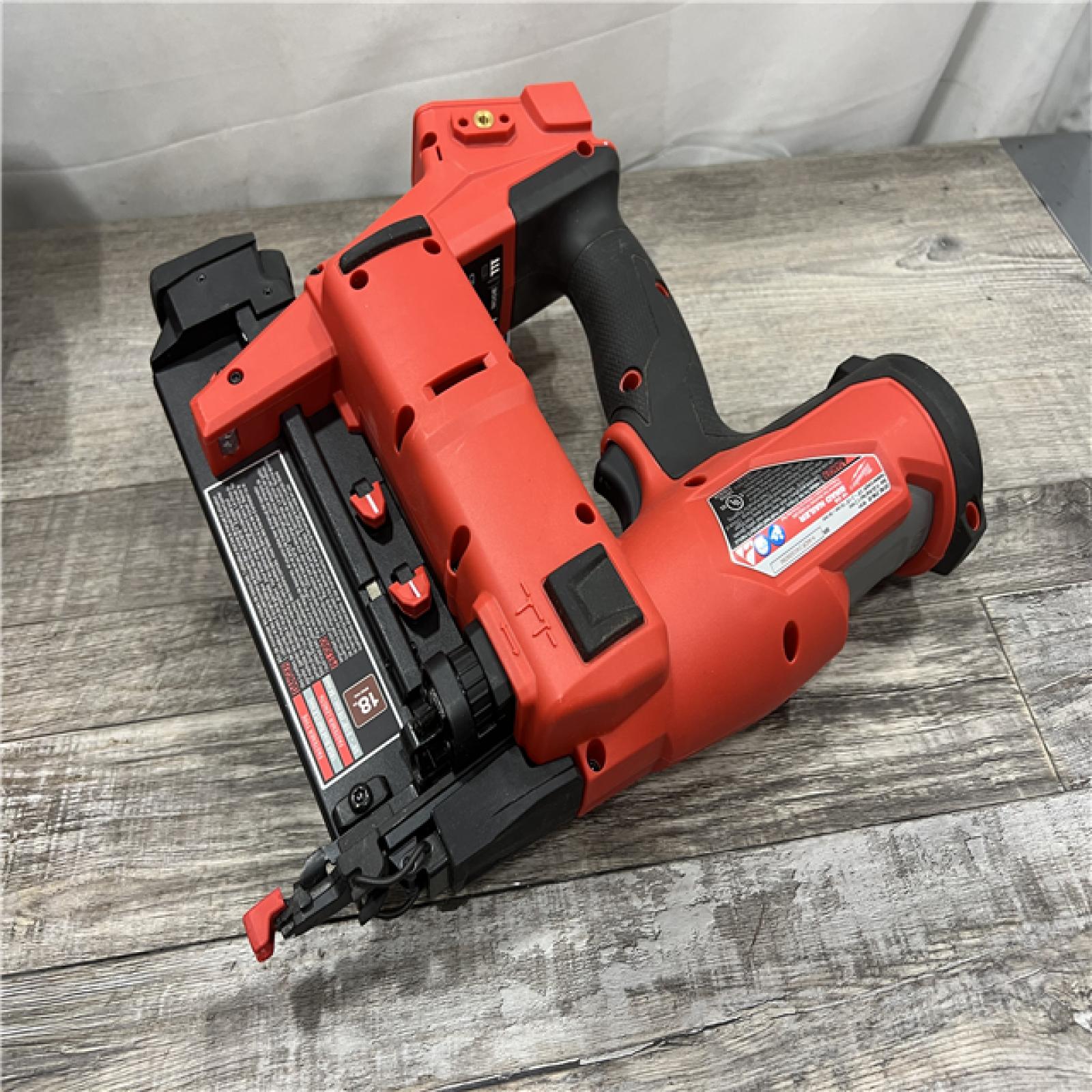 AS-IS MILWAUKEE M18 FUEL 18-Volt Lithium-Ion Brushless Cordless Gen II 18-Gauge Brad Nailer with 8.0 Ah Battery and Rapid Charger