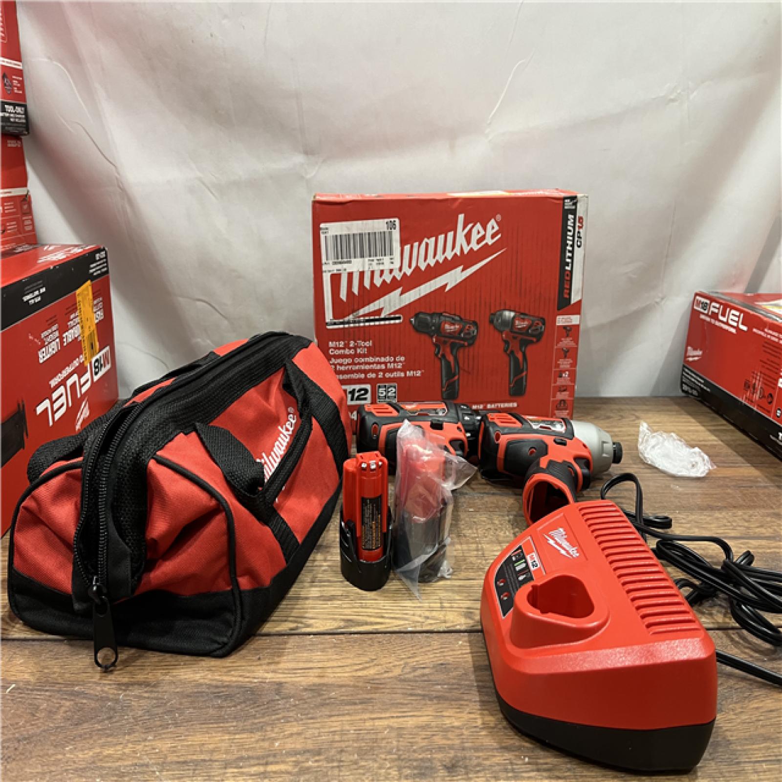 AS-IS MILWAUKEE M12 12V Lithium-Ion Cordless Drill Driver/Impact Driver Combo Kit with Two 1.5Ah Batteries, Charger and Bag (2-Tool)