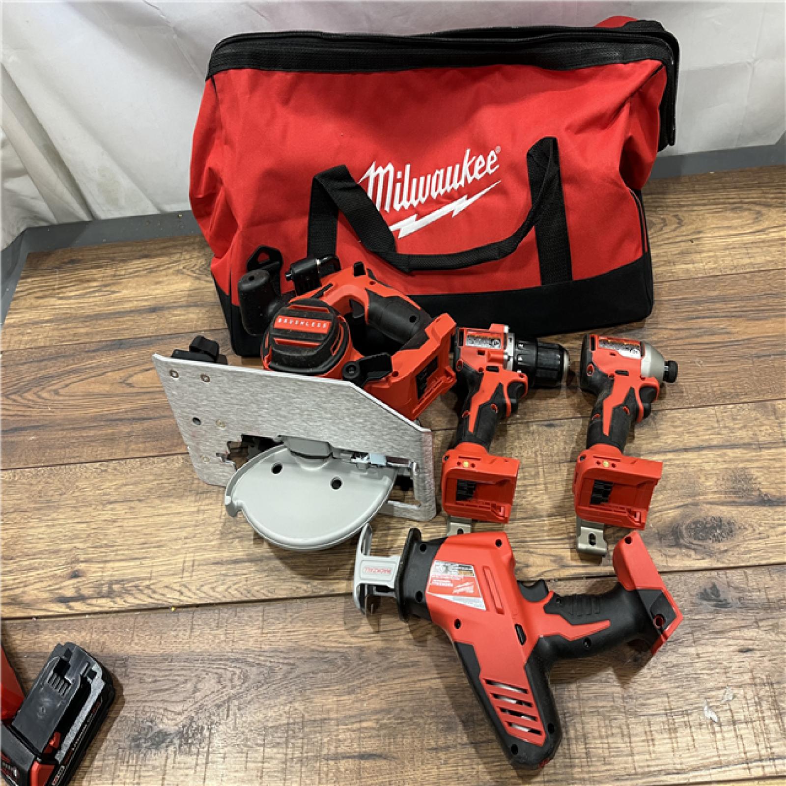 AS-IS Milwaukee M18 18-Volt Lithium-Ion Brushless Cordless Combo Kit (4-Tool) with 2-Batteries, 1-Charger and Tool Bag