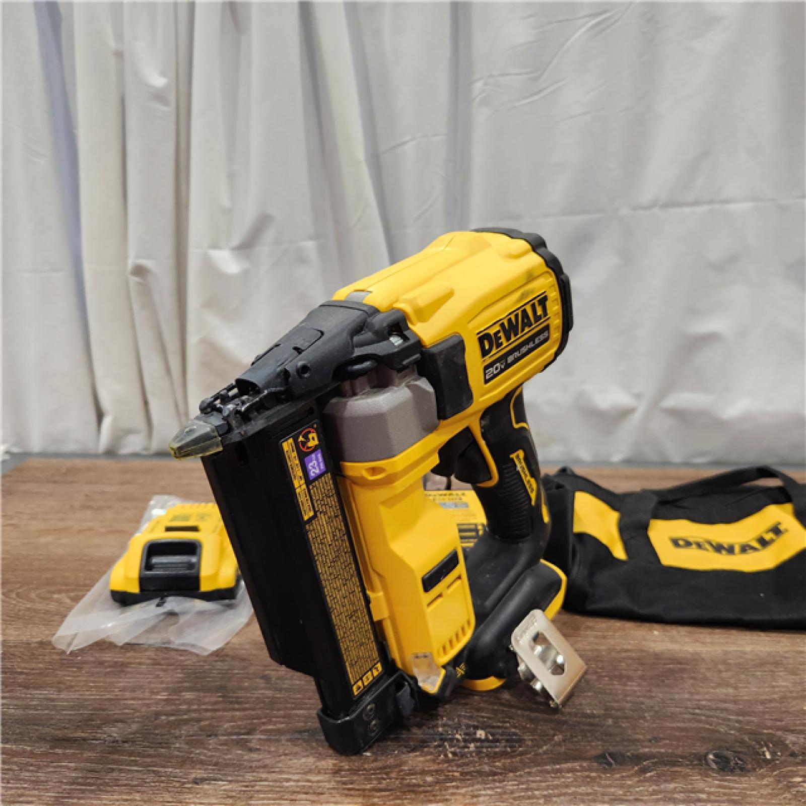 AS-IS DEWALT ATOMIC 20V MAX Lithium Ion Cordless 23 Gauge Pin Nailer Kit with 3.0Ah Battery and Charger