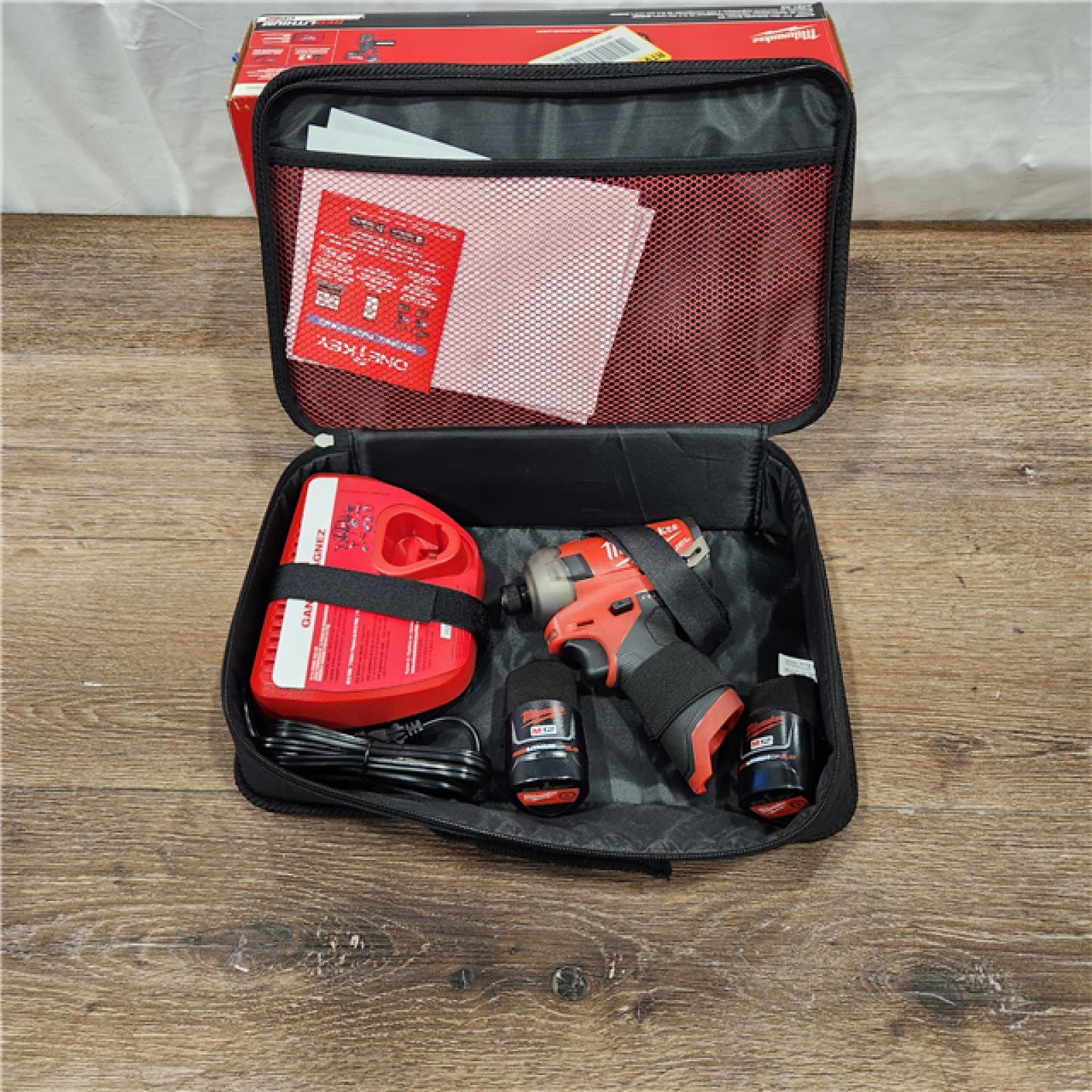 AS-IS M12 FUEL SURGE 12V Lithium-Ion Brushless Cordless 1/4 in. Hex Impact Driver Compact Kit W/Two 2.0Ah Batteries, Bag