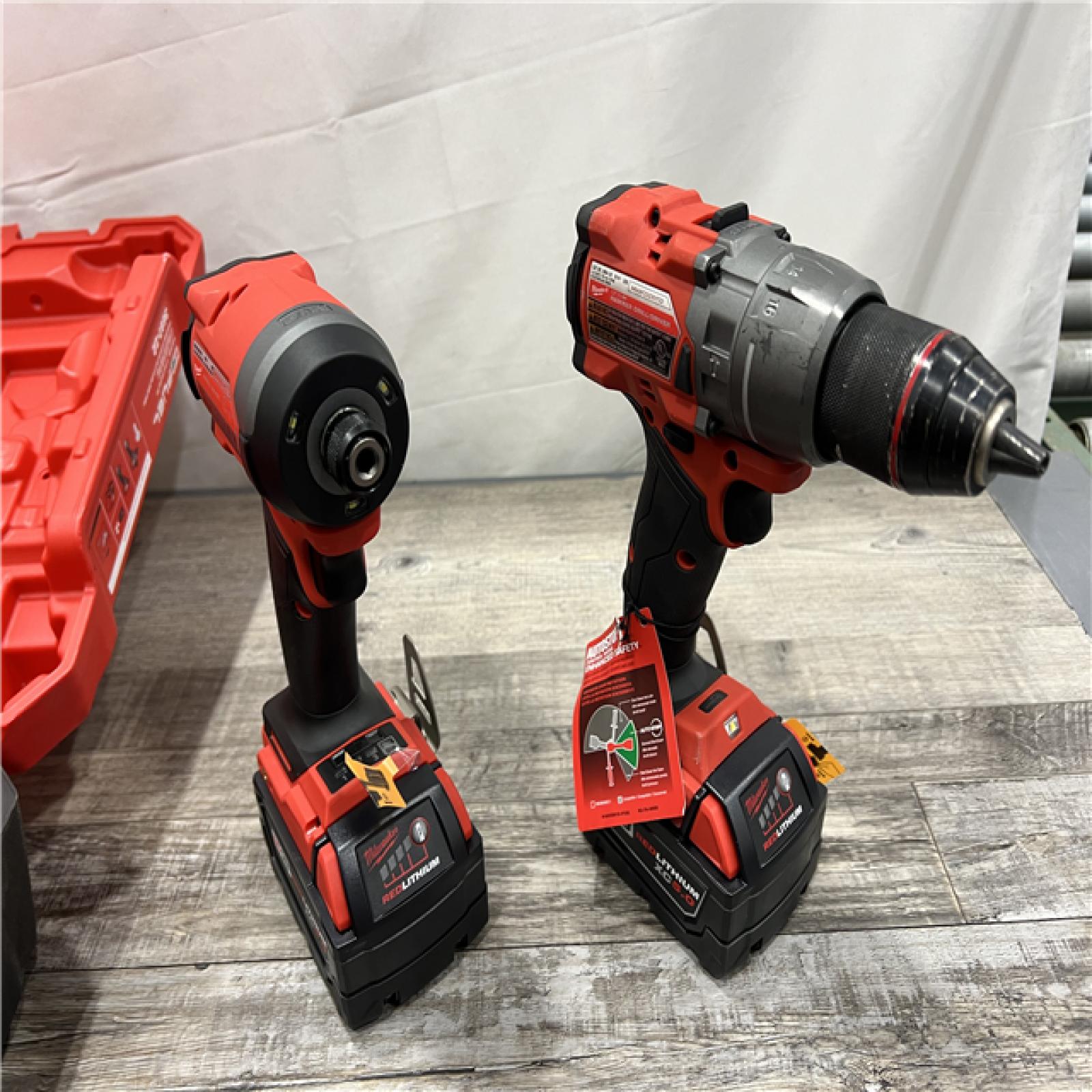 AS-IS Milwaukee M18 FUEL 18V Lithium-Ion Brushless Cordless Hammer Drill and Impact Driver Combo Kit (2-Tool) with 2 Batteries