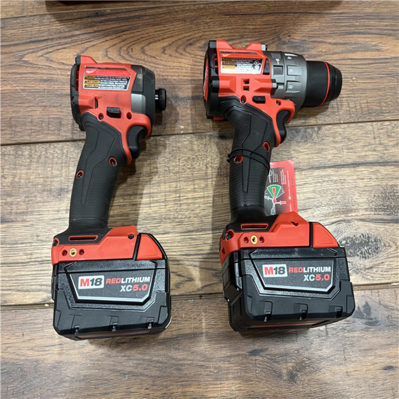 AS-IS Milwaukee M18 FUEL 18V Lithium-Ion Brushless Cordless Hammer Drill and Impact Driver Combo Kit (2-Tool) with 2 Batteries