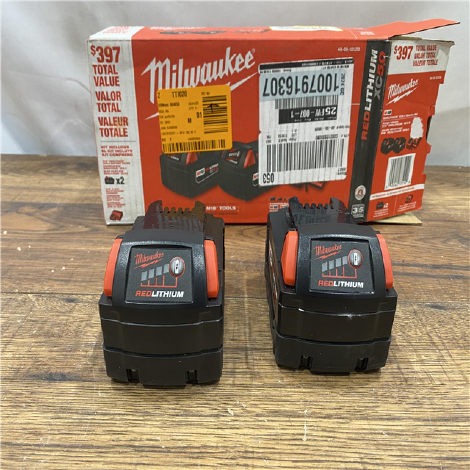 AS IS M18 18-Volt Lithium-Ion XC Starter Kit with Two 5.0Ah Batteries and Charger