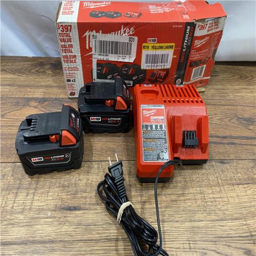 AS IS Milwaukee M18 18-Volt Lithium-Ion XC Starter Kit with Two 5.0Ah Batteries / Charger (48-59-1852B)