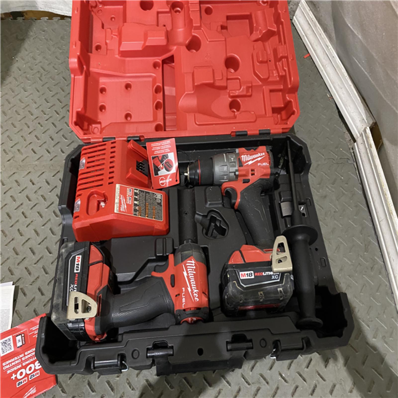 Houston location AS-IS Milwaukee 3697-22 M18 FUEL 1/2 Hammer Driller/Driver &1/4 Hex Impact Driver 2 Tool Combo Kit