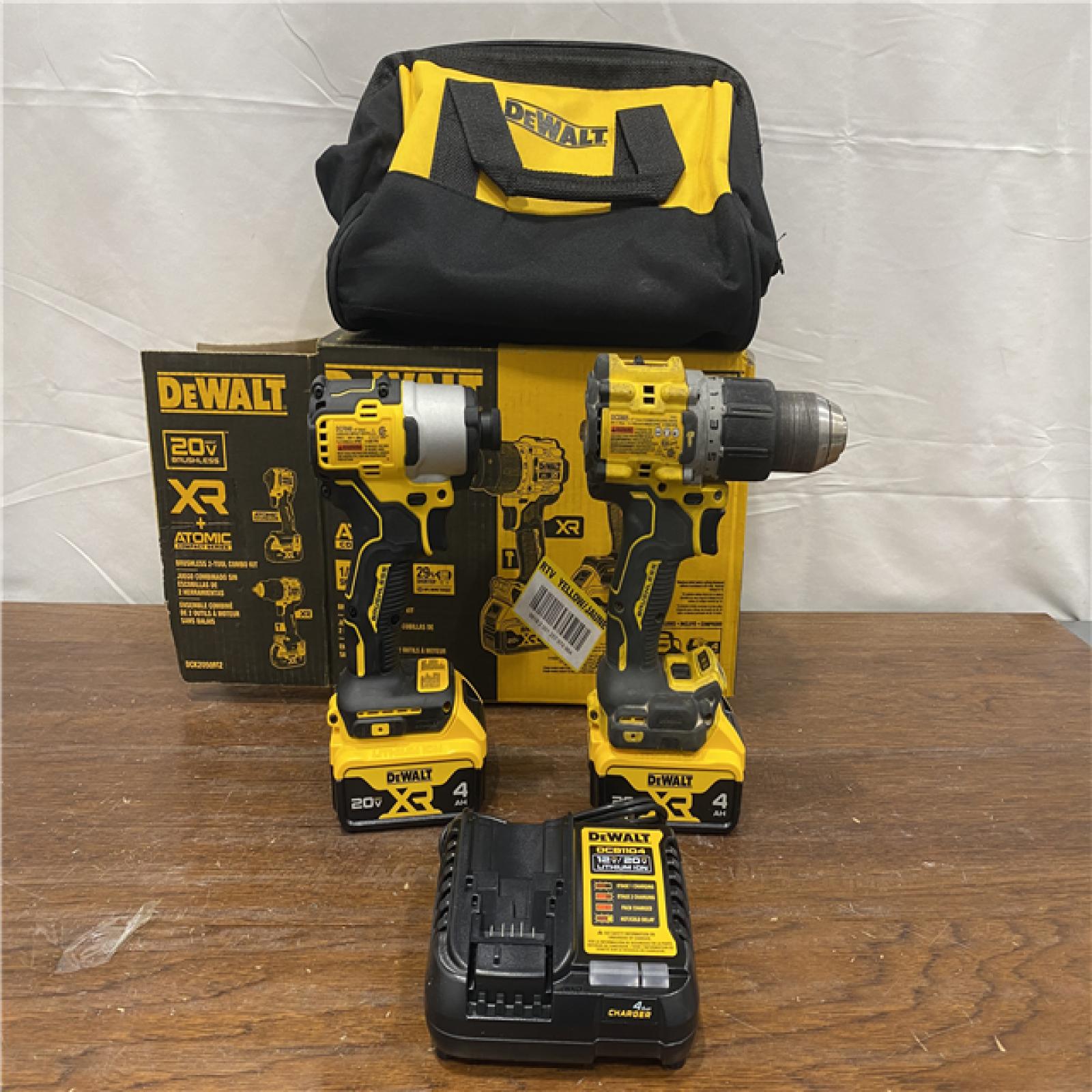 AS-IS DEWALT 20V MAX XR Hammer Drill and ATOMIC Impact Driver 2 Tool Cordless Combo Kit with (2) 4.0Ah Batteries, Charger, and Bag