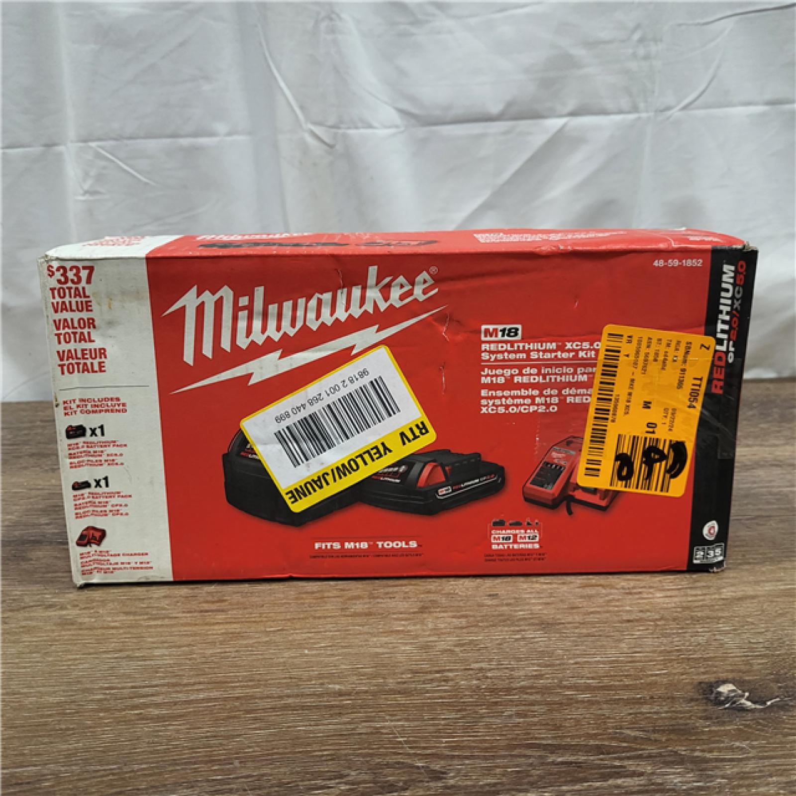 AS-IS Milwaukee M18 18-Volt Lithium-Ion Starter Kit with One 5.0 Ah and One 2.0 Ah Battery and Charger