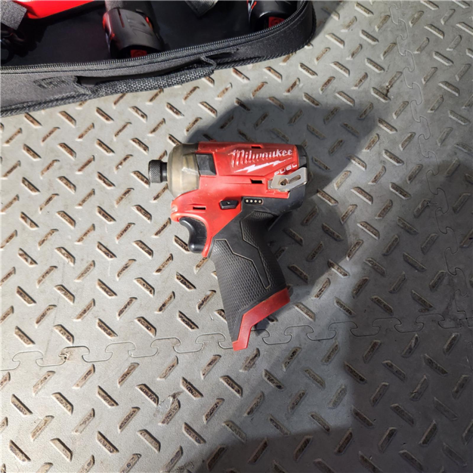 Houston location AS-IS MILWAUKEE M12 FUEL SURGE 12V Lithium-Ion Brushless Cordless 1/4 in. Hex Impact Driver Compact Kit W/Two 2.0Ah Batteries, Bag