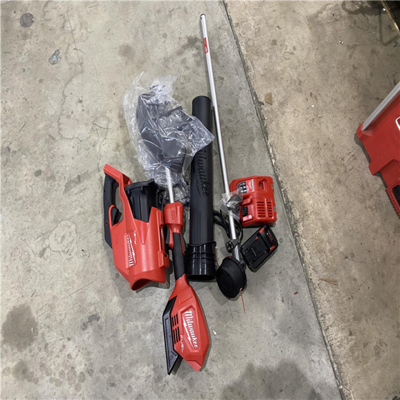 Houston location AS-IS Milwaukee 3000-21 M18 FUEL Brushless Lithium-Ion Cordless String Trimmer with QUIK-LOK / Blower Combo Kit (8 Ah)