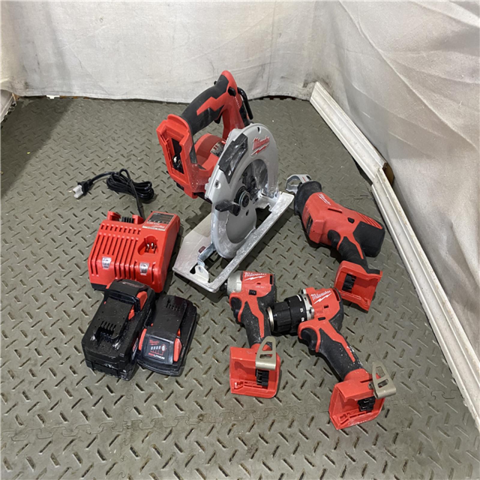 Houston location AS-IS MILWAUKEE M18 18-Volt Lithium-Ion Brushless Cordless Combo Kit (4-Tool) with 2-Batteries, 1-Charger and Tool Bag