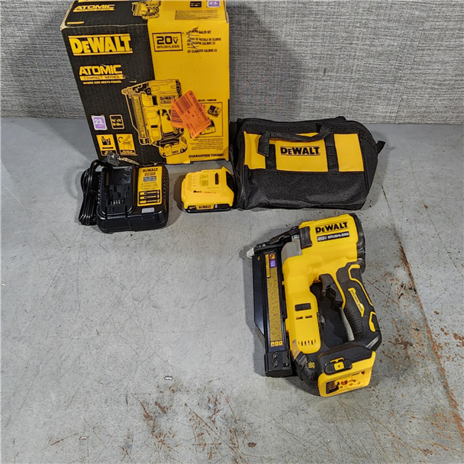 HOUSTON LOCATION - AS-IS DEWALT ATOMIC 20V MAX Lithium Ion Cordless 23 Gauge Pin Nailer Kit with 2.0Ah Battery and Charger