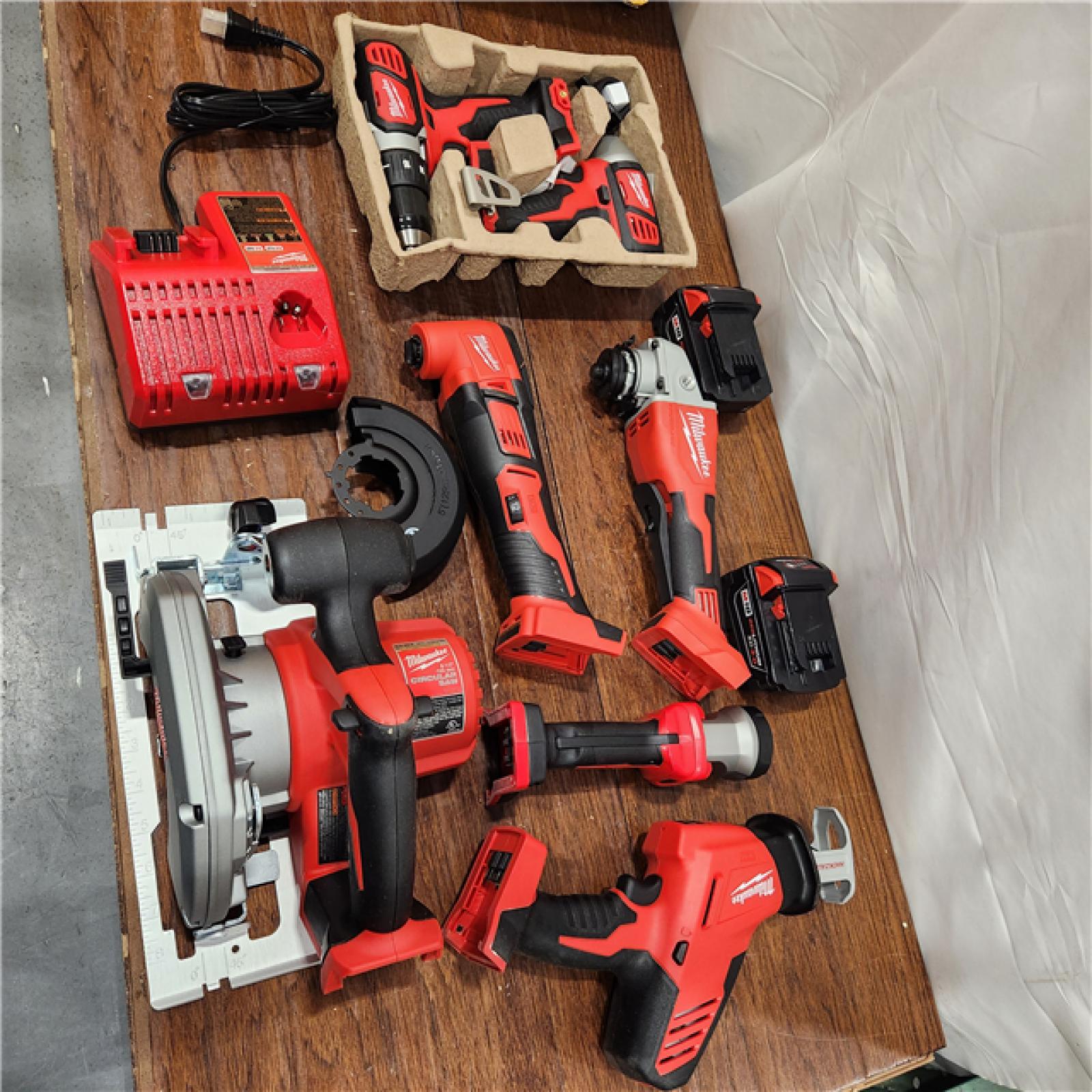 AS-IS Milwaukee M18 18-Volt Lithium-Ion Cordless Combo Kit 7-Tool with 2-Batteries, Charger and Tool Bag