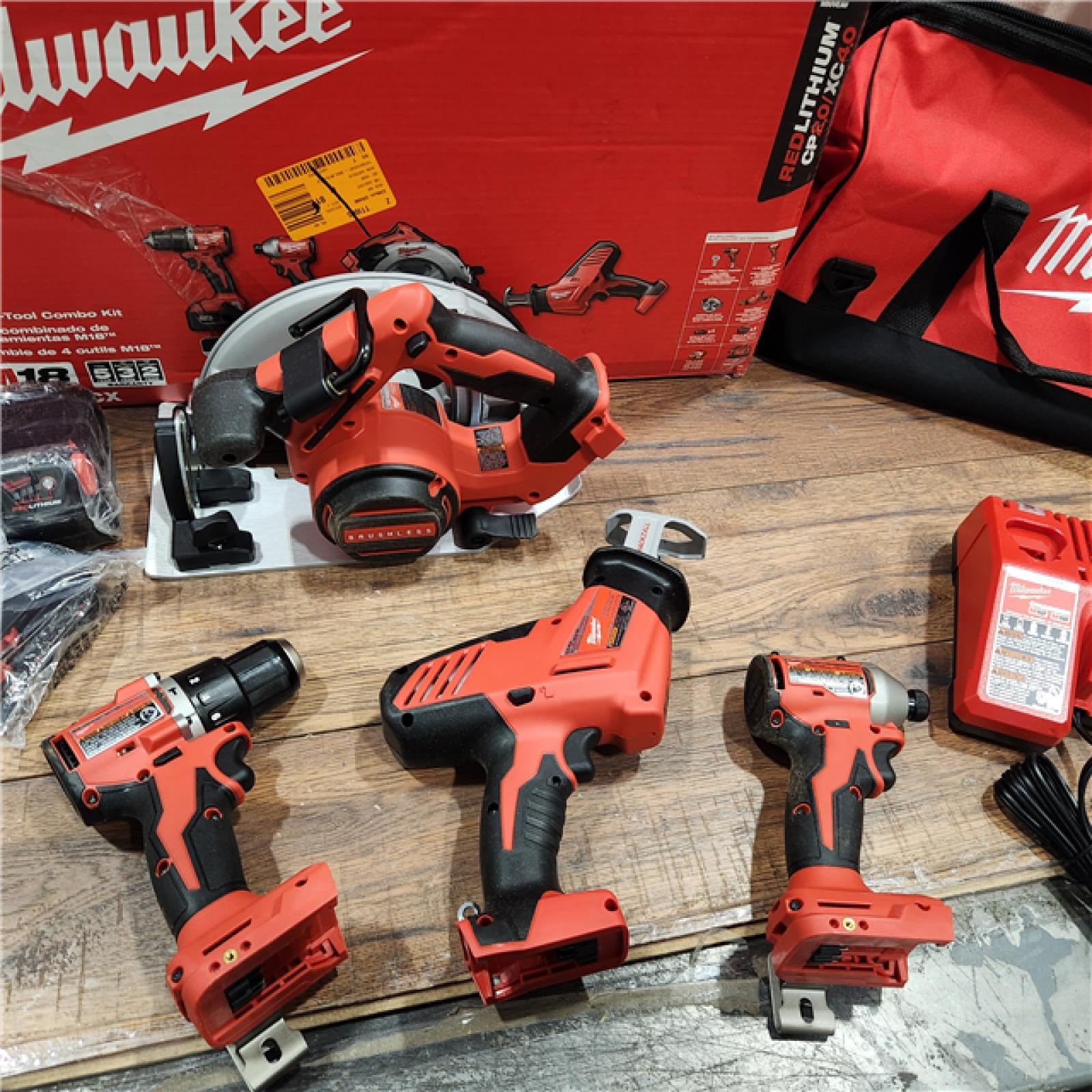 AS-IS Milwaukee M18 18-Volt Lithium-Ion Brushless Cordless Combo Kit (4-Tool) with 2-Batteries, 1-Charger and Tool Bag